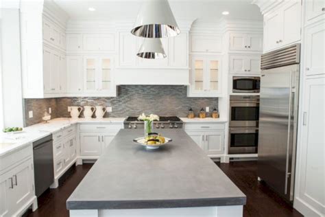 white cabinets with concrete countertops